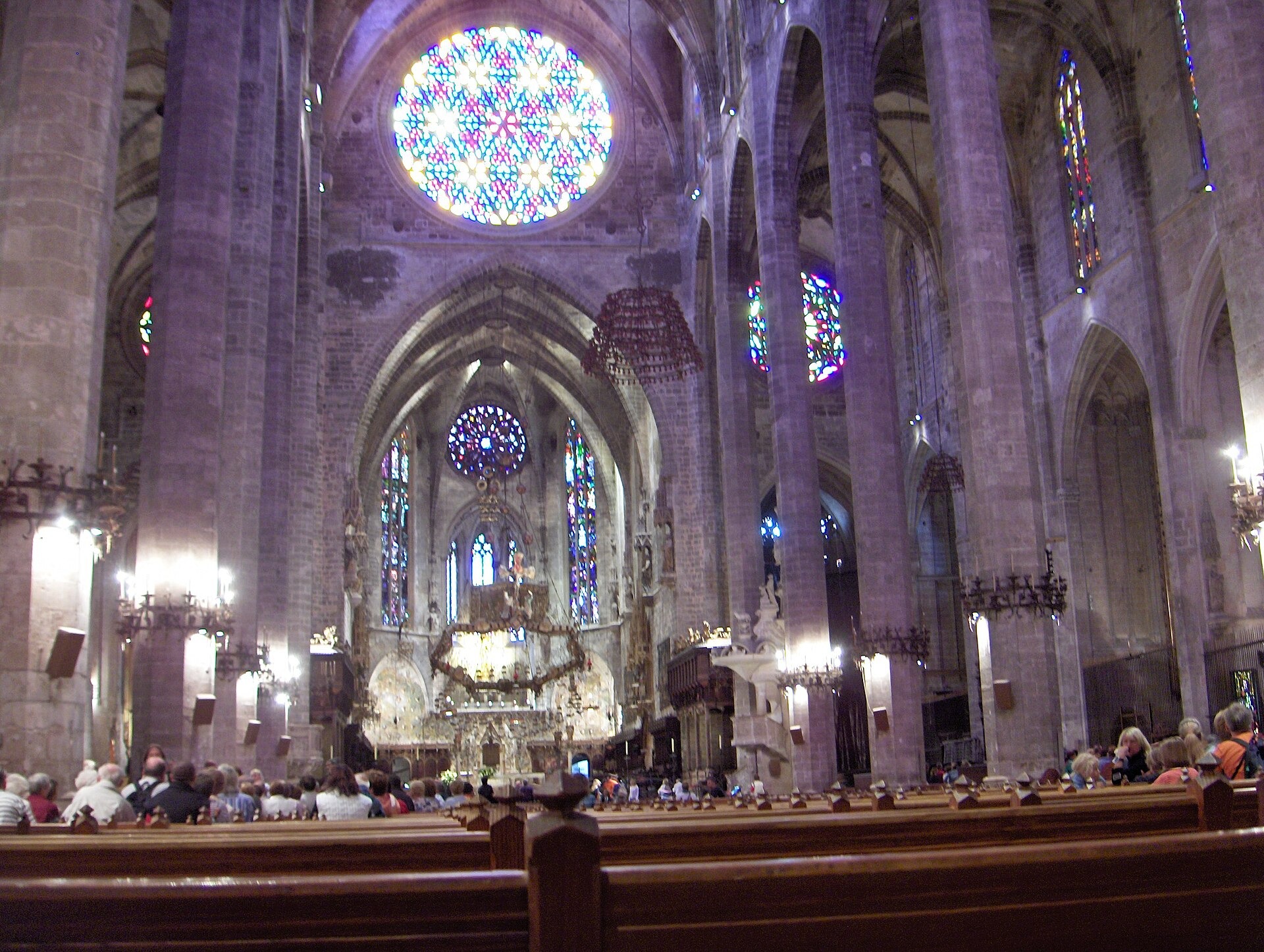 The rose window and Gothic nave inside Palma Cathedral on a rainy day