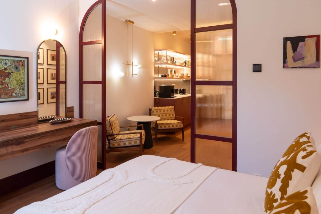 Retreat Suite with arched doors and a dressing area at Casa Roca