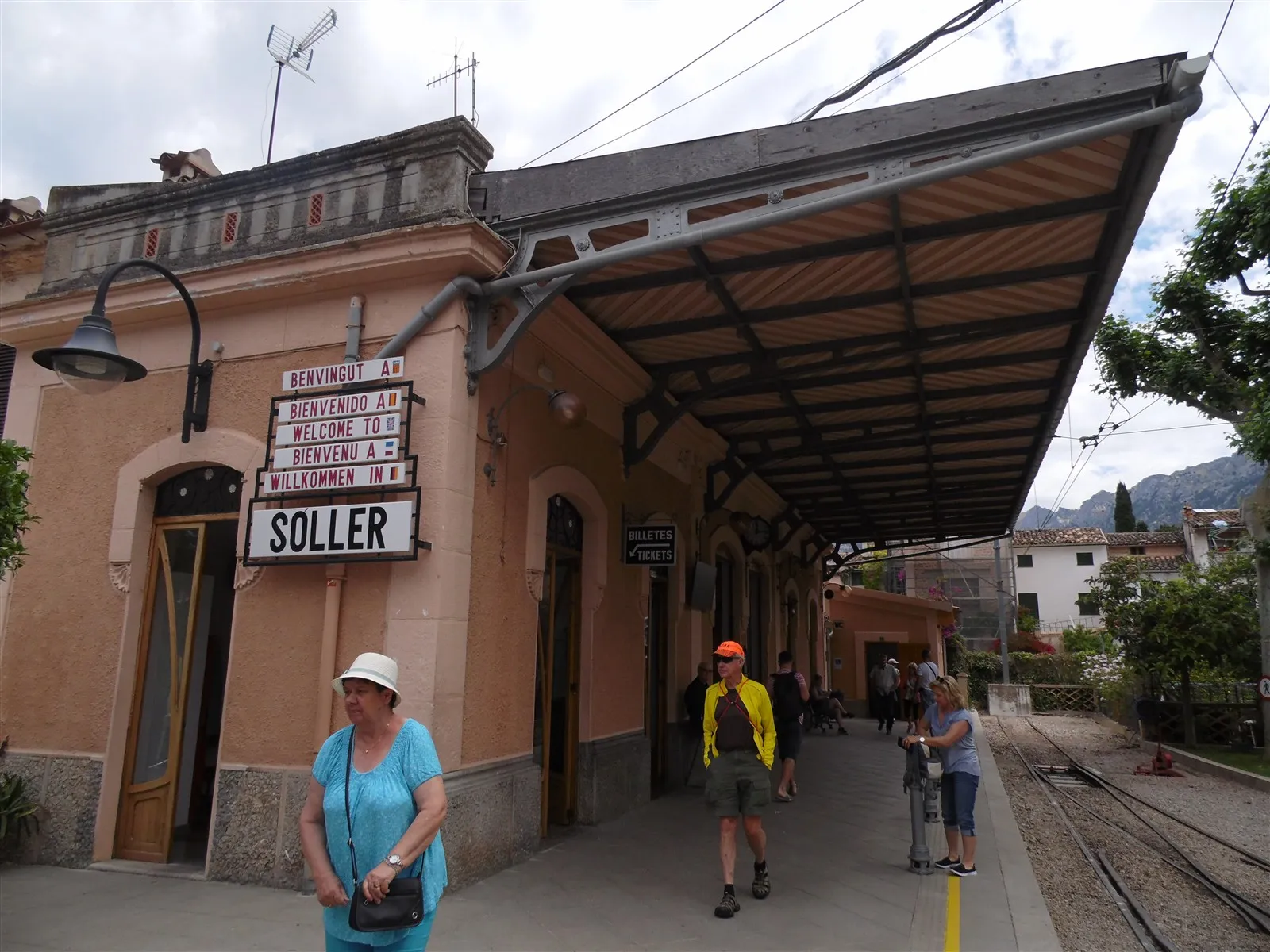 Passengers on the platform at Soller station beneath the vintage railway canopy