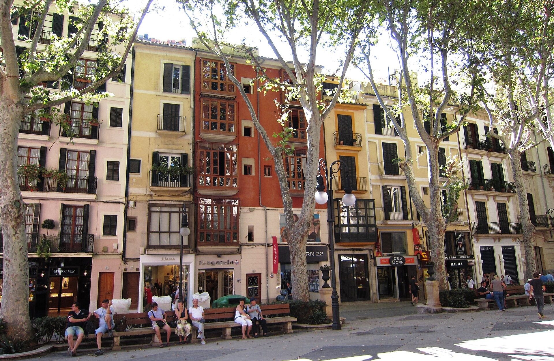 Colourful townhouses and plane trees on the Passeig des Born in Palma